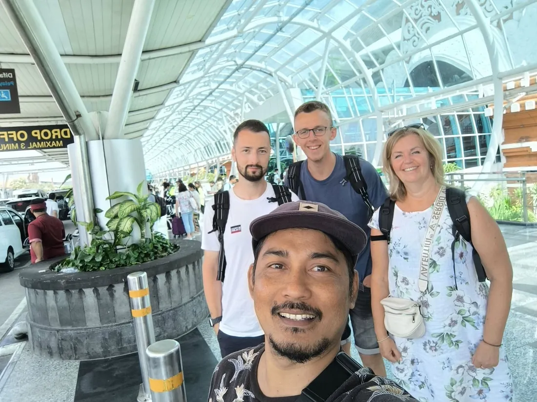 Mougly welcoming travelers at the airport