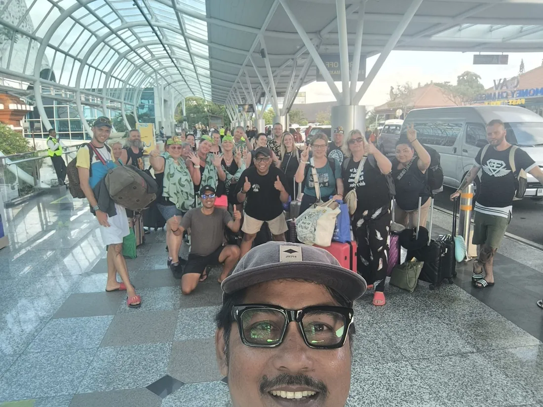 Large happy group arriving in Bali