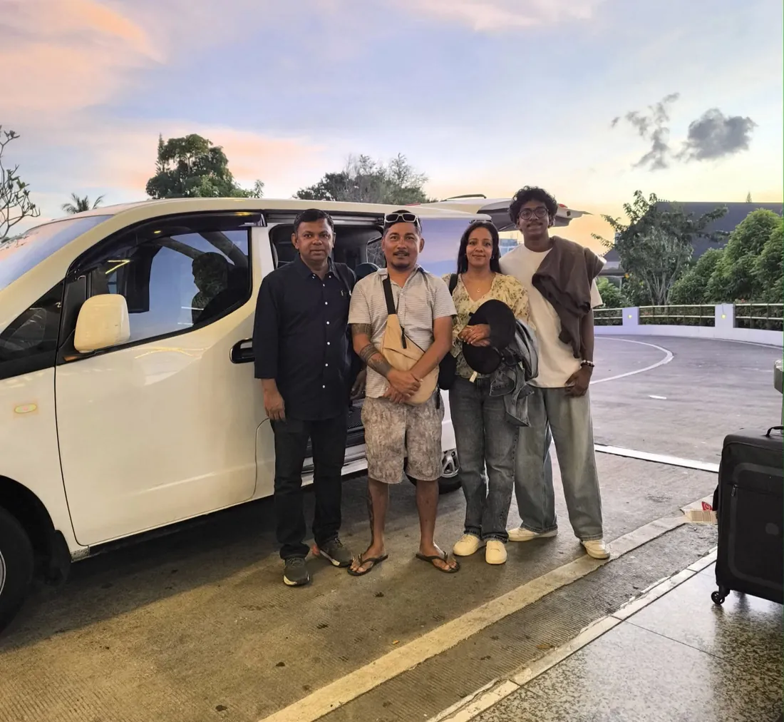 Family by Mougly's clean private van at dusk